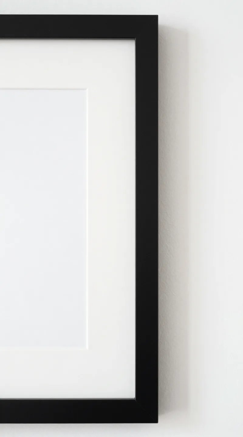 closeup of black matte frame with white mat on wall