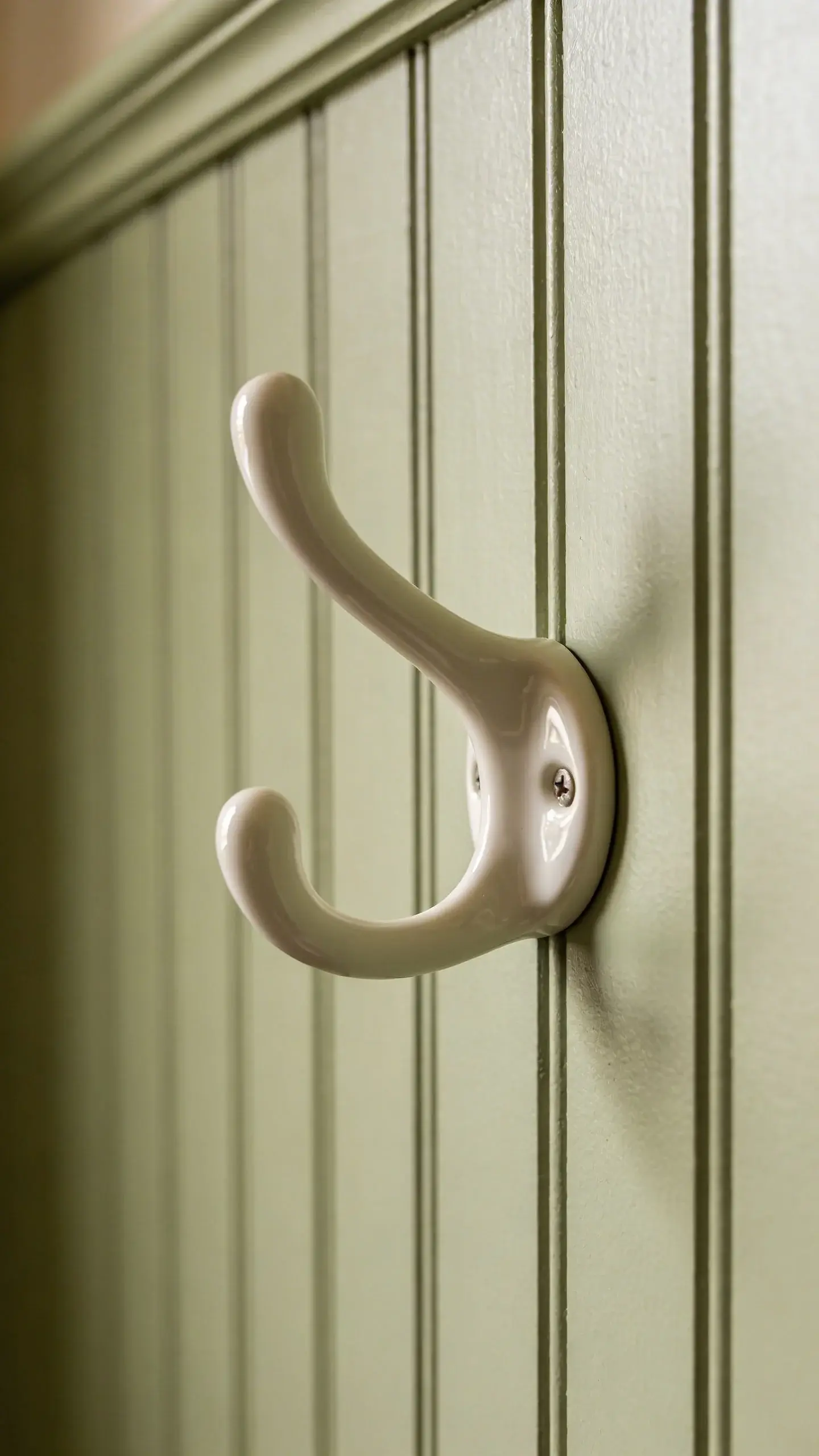 beadboard wall in soft sage with porcelain hook